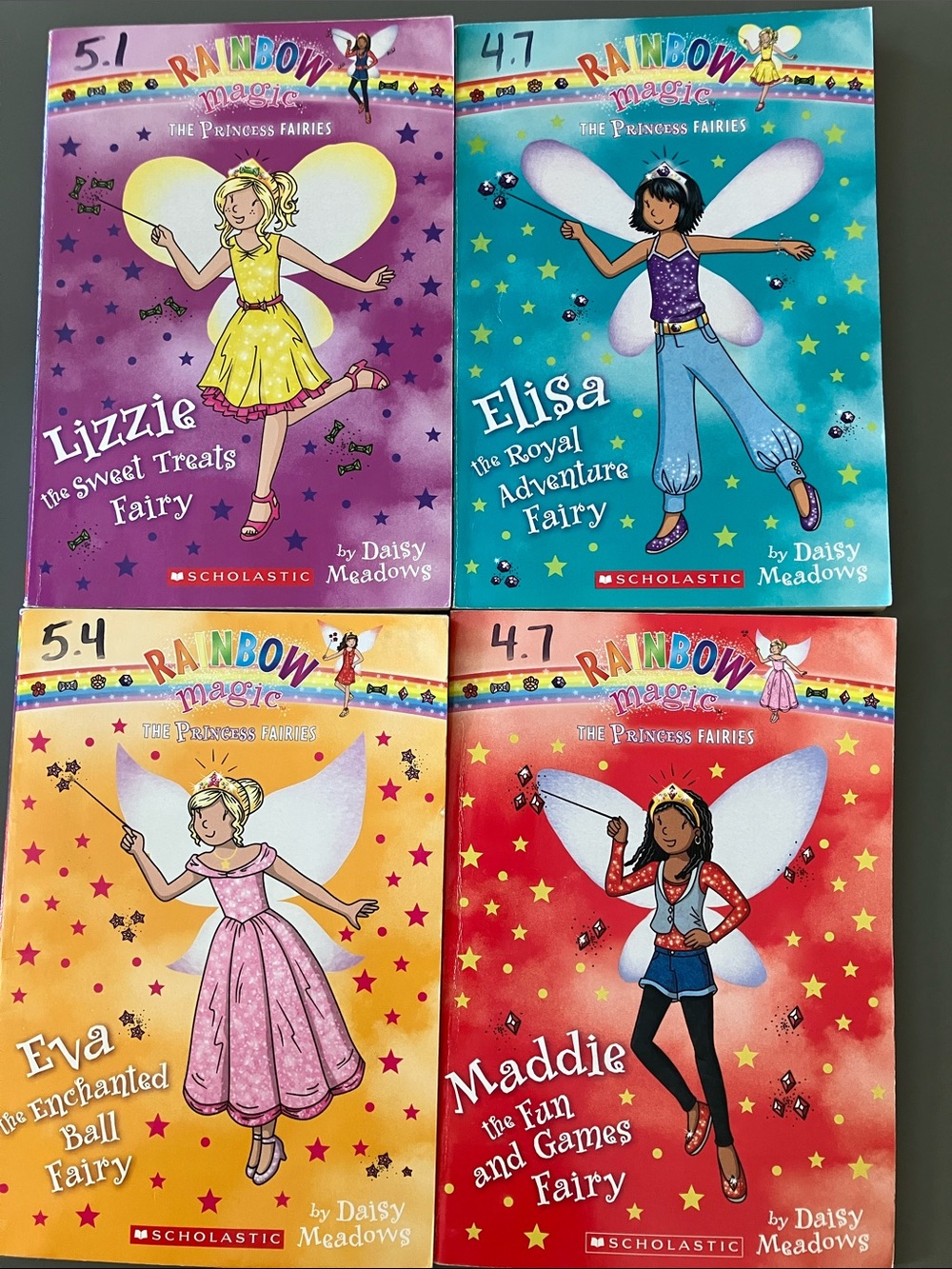 Scholastic Rainbow Magic Princess Fairies Set - Gold, Purple, Teal, Yellow